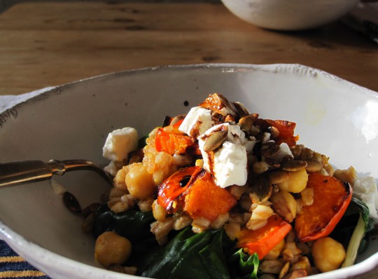 Warm farro and roasted squash salad over wilted chard