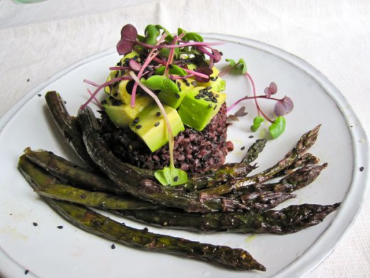 Roasted asparagus with black rice, avocado and radish sprouts