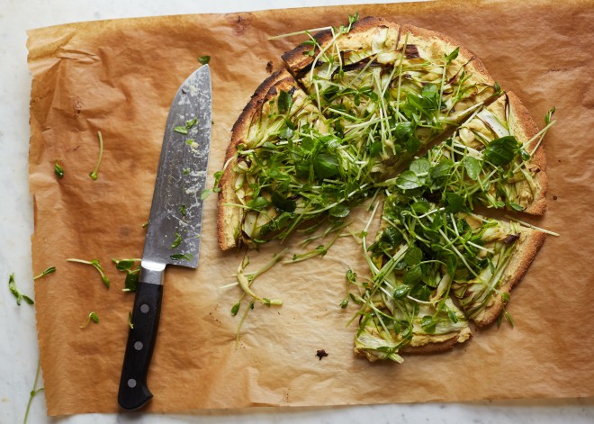 Chickpea pizza with asparagus and pea shoot tangle
