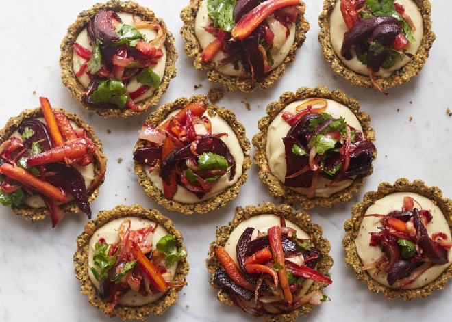 Roasted root vegetable tarts with spiced sesame crust